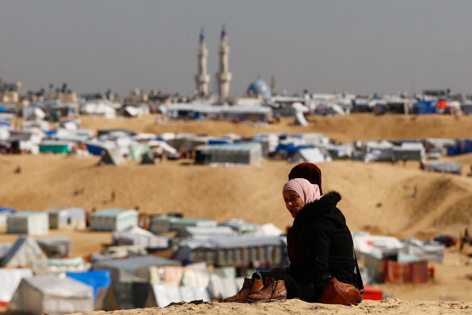 People sit outside as displaced Palestinians, who fled their houses due to Israeli strikes, take shelter in a tent camp, amid the ongoing conflict between Israel and the Palestinian Islamist group Hamas, at the border with Egypt, in Rafah in the southern Gaza Strip, February 8, 2024. REUTERS/Ibraheem Abu Mustafa Photo: IBRAHEEM ABU MUSTAFA/REUTERS