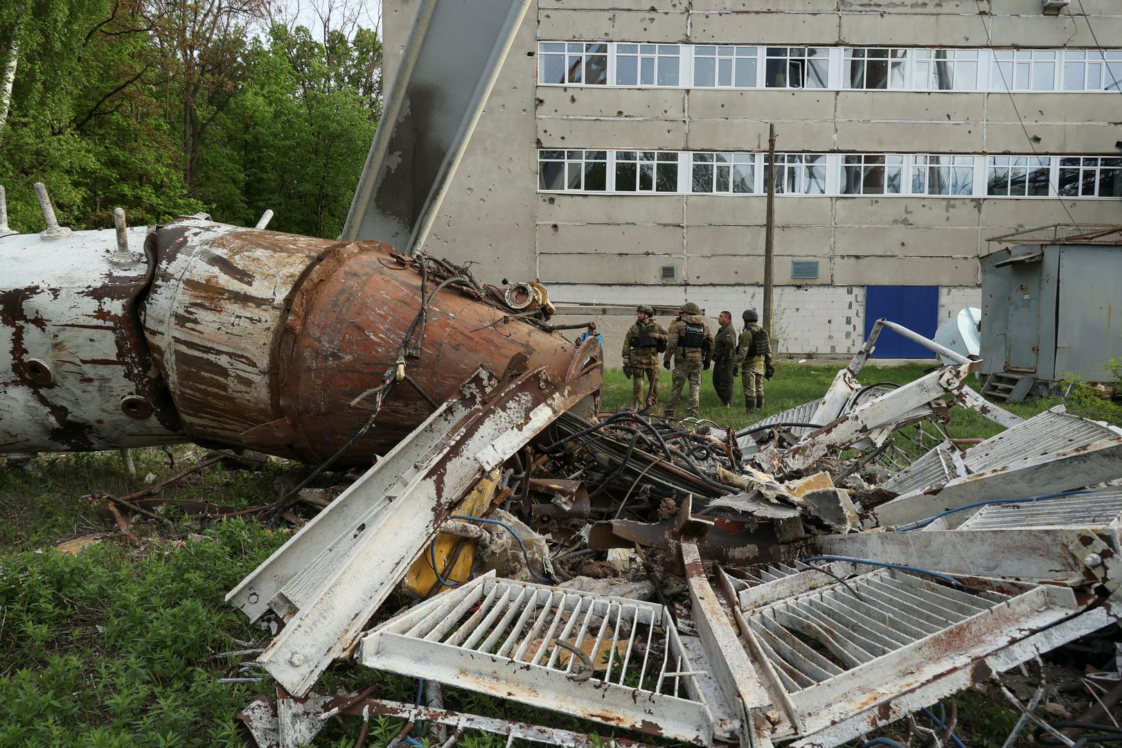 Police officers stand next to a part of a television tower partially destroyed by a Russian missile strike, amid Russia's attack on Ukraine, in Kharkiv, Ukraine April 22, 2024. REUTERS/Sofiia Gatilova Photo: Sofiia Gatilova/REUTERS