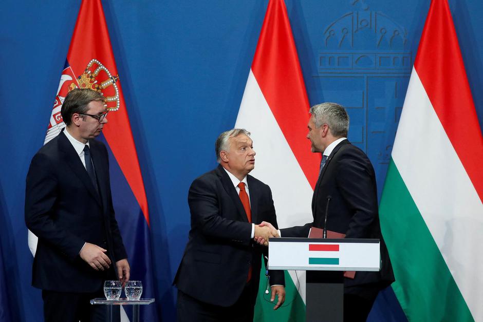 Hungarian PM Orban, Austrian Chancellor Nehammer and Serbian President Vucic attend a news conference in Budapest