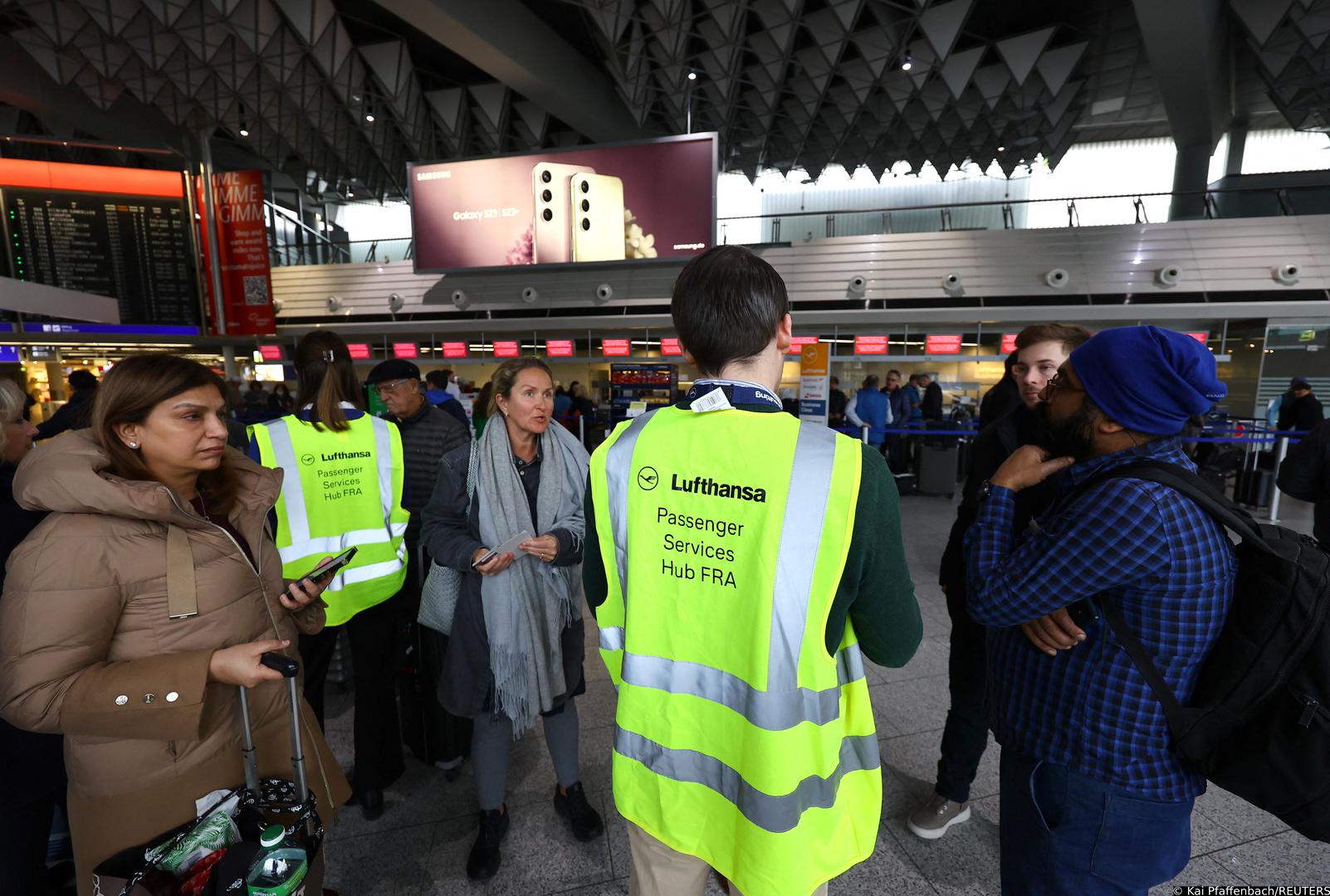 Lufthansa service staff talks to passengers after an IT fault at Germany?s Lufthansa causes massive flight delays and disruptions in Frankfurt, Germany, February 15, 2023.     REUTERS/Kai Pfaffenbach Photo: Kai Pfaffenbach/REUTERS