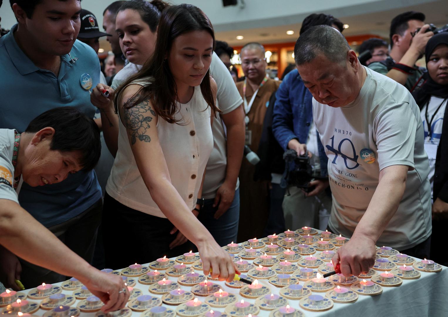 Family members of the missing Malaysia Airlines flight MH370 light candles during a remembrance event marking the 10th anniversary of its disappearance, in Subang Jaya, Malaysia March 3, 2024. REUTERS/Hasnoor Hussain Photo: HASNOOR HUSSAIN/REUTERS