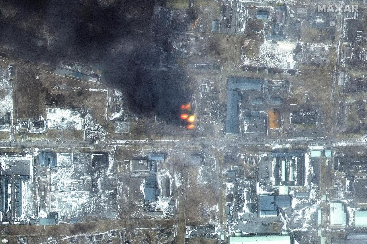 A satellite image shows a multispectral view of fires in an industrial area, in the western section of Mariupol