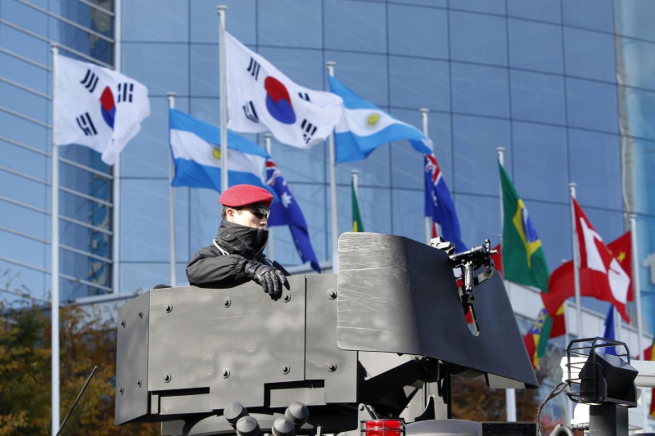 \'A South Korean police SWAT officer stands guard outside the venue of the G20 Summit in Seoul November 10, 2010. Security was tight in Seoul, with police and armed forces on high alert, but there hav