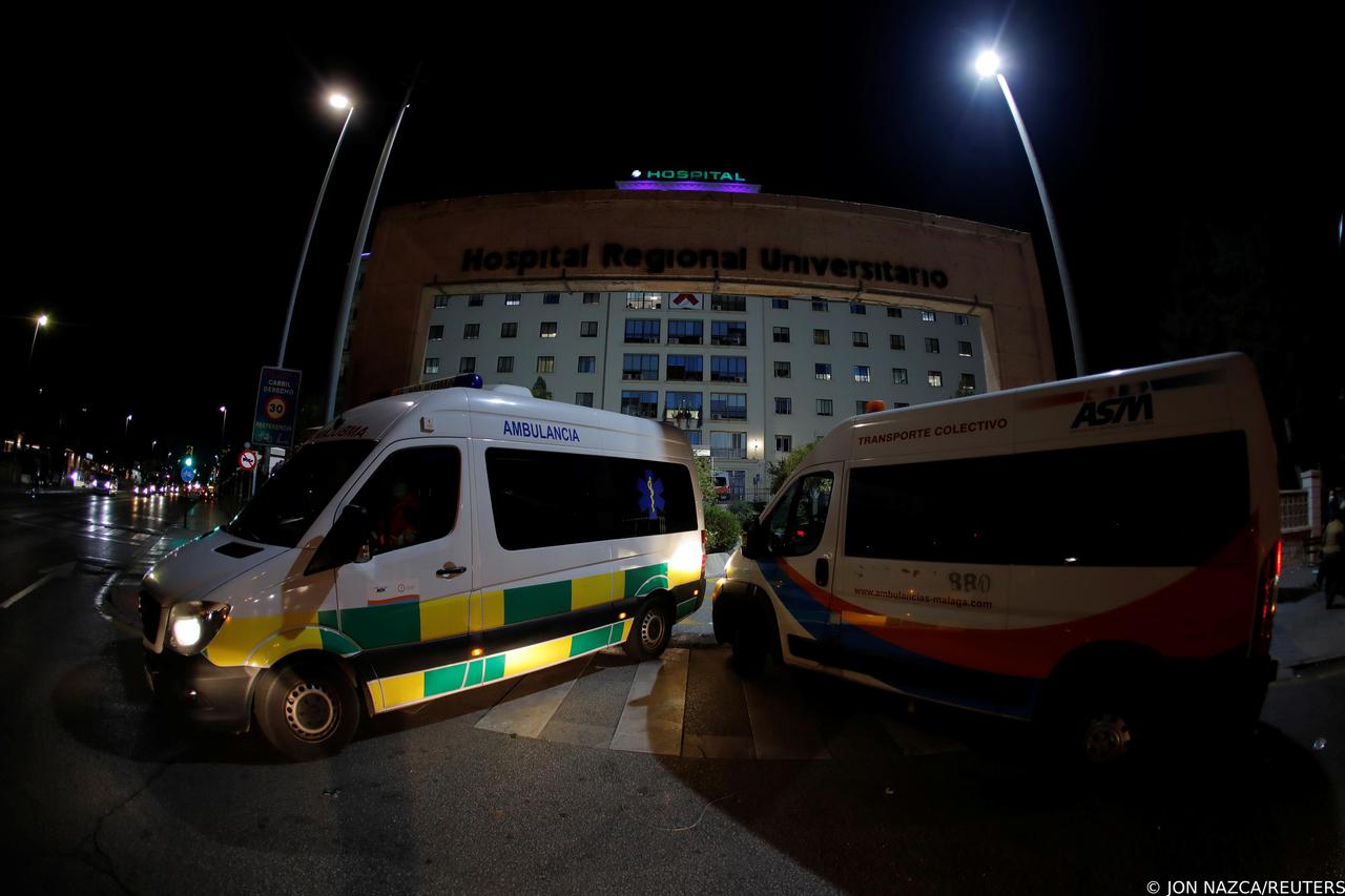 Ambulances drive at the front entrance of the Malaga Regional University Hospital