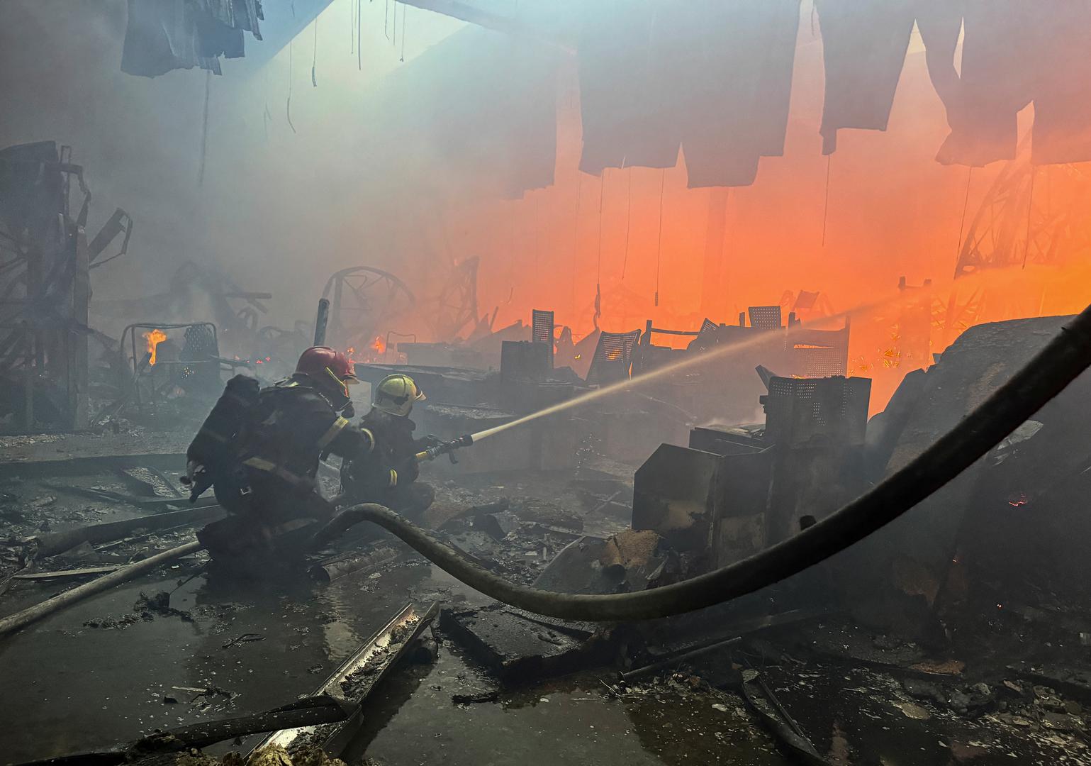 Firefighters work at a site of a household item shopping mall hit by a Russian air strike, amid Russia's attack on Ukraine, in Kharkiv, Ukraine May 25, 2024. REUTERS/Vitalii Hnidyi Photo: Vitalii Hnidyi/REUTERS