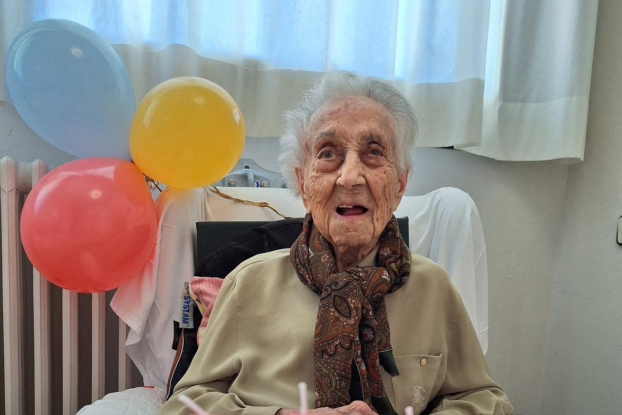 World's oldest woman, Maria Branyas, poses in front of a birthday cake as she celebrates her 117 birthday in a nursing home, in Girona