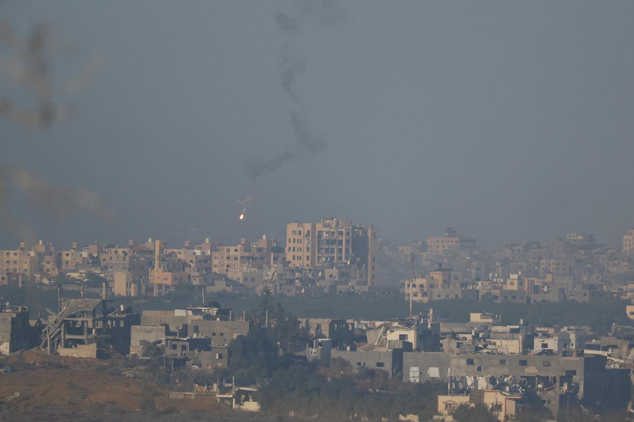 A flare falls over Gaza, as seen from southern Israel