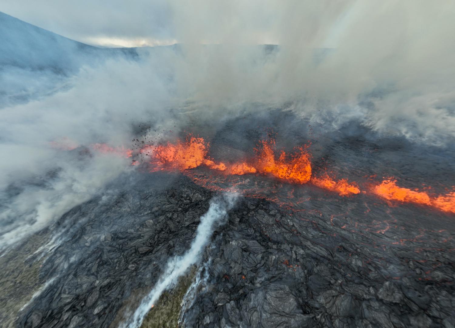 Smoke billows and lava spurts after the eruption of a volcano, on the Reykjanes peninsula, near the capital Reykjavik, in southwest Iceland, July 10, 2023, in this picture obtained from social media. Juergen Merz - Glacier Photo Artist/via REUTERS  THIS IMAGE HAS BEEN SUPPLIED BY A THIRD PARTY. MANDATORY CREDIT. NO RESALES. NO ARCHIVES. Photo: JUERGEN MERZ - GLACIER PHOTO ART/REUTERS