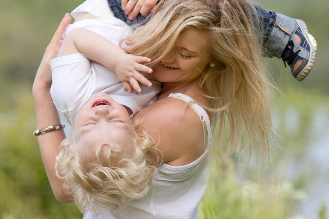 Mother and Son Playing in Meadow