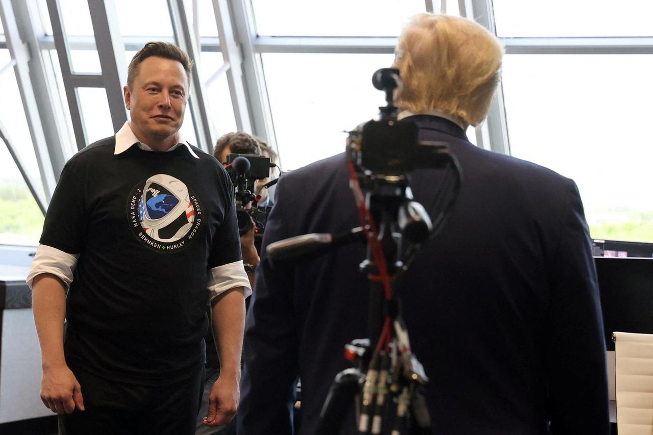 FILE PHOTO: U.S. President Donald Trump and Elon Musk are seen at the Firing Room Four after the launch of a SpaceX Falcon 9 rocket and Crew Dragon spacecraft, from Cape Canaveral