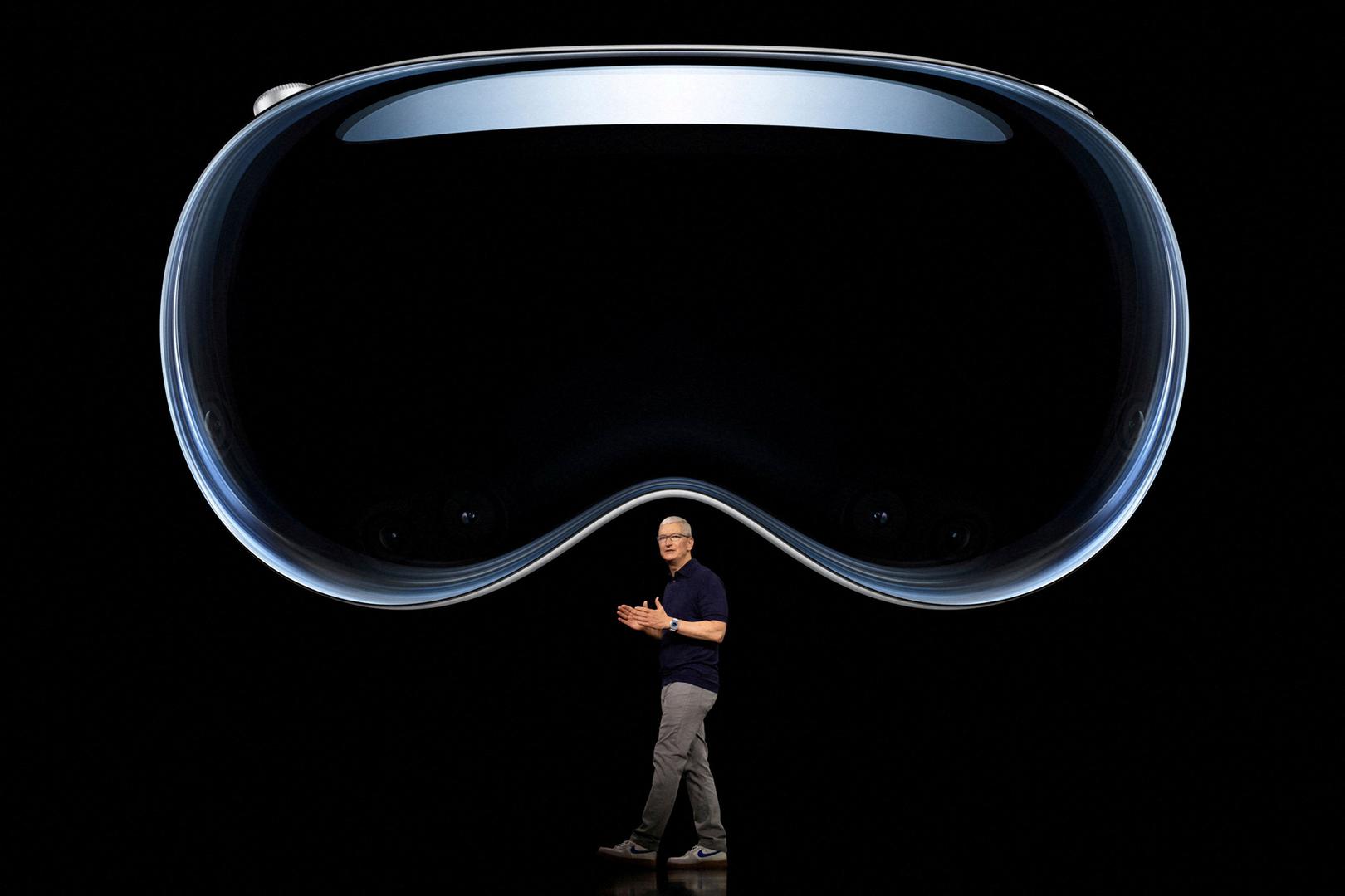 Apple CEO Tim Cook speaks under an image of Apple Vision Pro at Apple Park in Cupertino, California, U.S. June 5, 2023.  Joe Pugliese/Apple Inc./Handout via REUTERS  NO RESALES. NO ARCHIVES. HATHIS IMAGE HAS BEEN SUPPLIED BY A THIRD PARTY.     TPX IMAGES OF THE DAY Photo: Joe Pugliese/Apple Inc./REUTERS