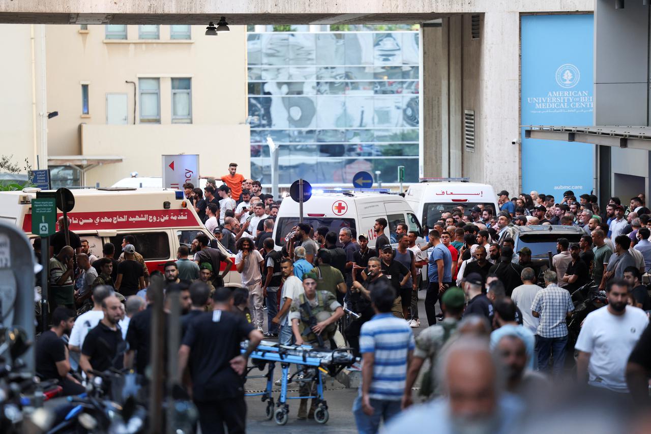 People gather outside a hospital, as more than 1,000 people, including Hezbollah fighters and medics, were wounded on Tuesday when the pagers they use to communicate exploded across Lebanon, according to a security source, in Beirut