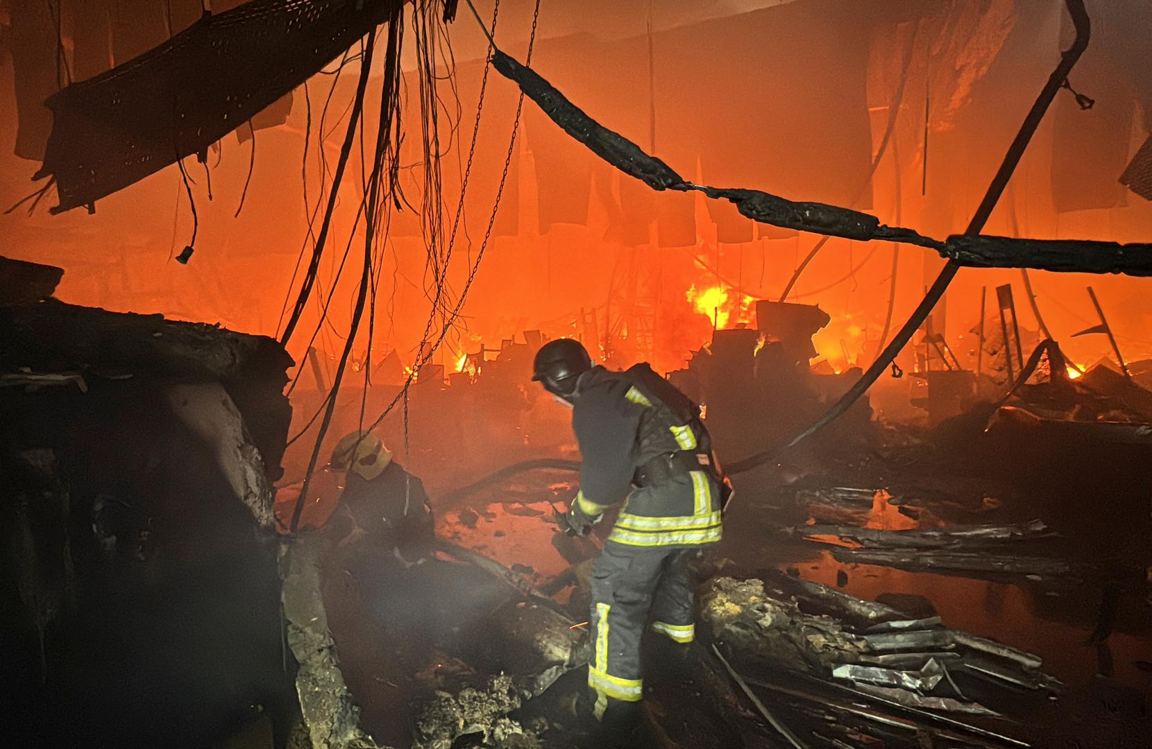 Firefighters work at a site of a household item shopping mall hit by a Russian air strike, amid Russia's attack on Ukraine, in Kharkiv, Ukraine May 25, 2024. REUTERS/Vitalii Hnidyi Photo: Vitalii Hnidyi/REUTERS