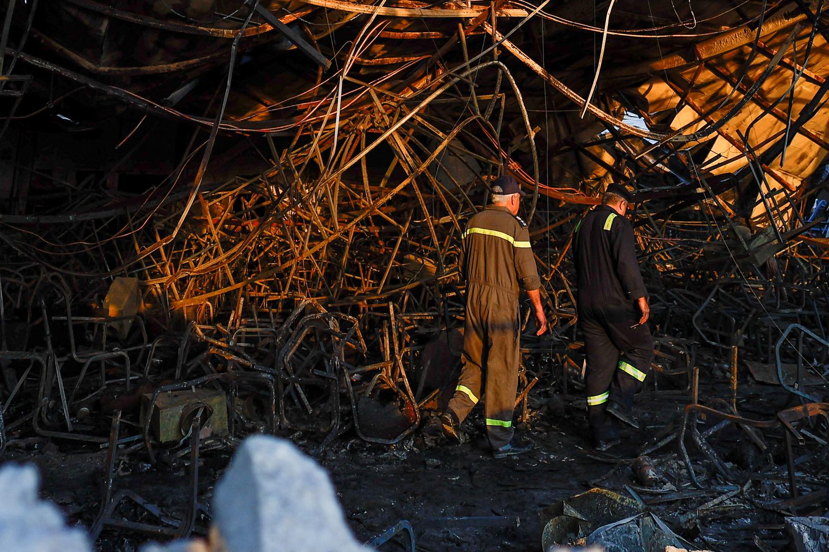 Officials walk through the rubble at the site following a fatal fire at a wedding celebration, in the district of Hamdaniya in Iraq's Nineveh province, Iraq, September 27, 2023. REUTERS/Khalid Al-Mousily Photo: KHALID AL-MOUSILY/REUTERS