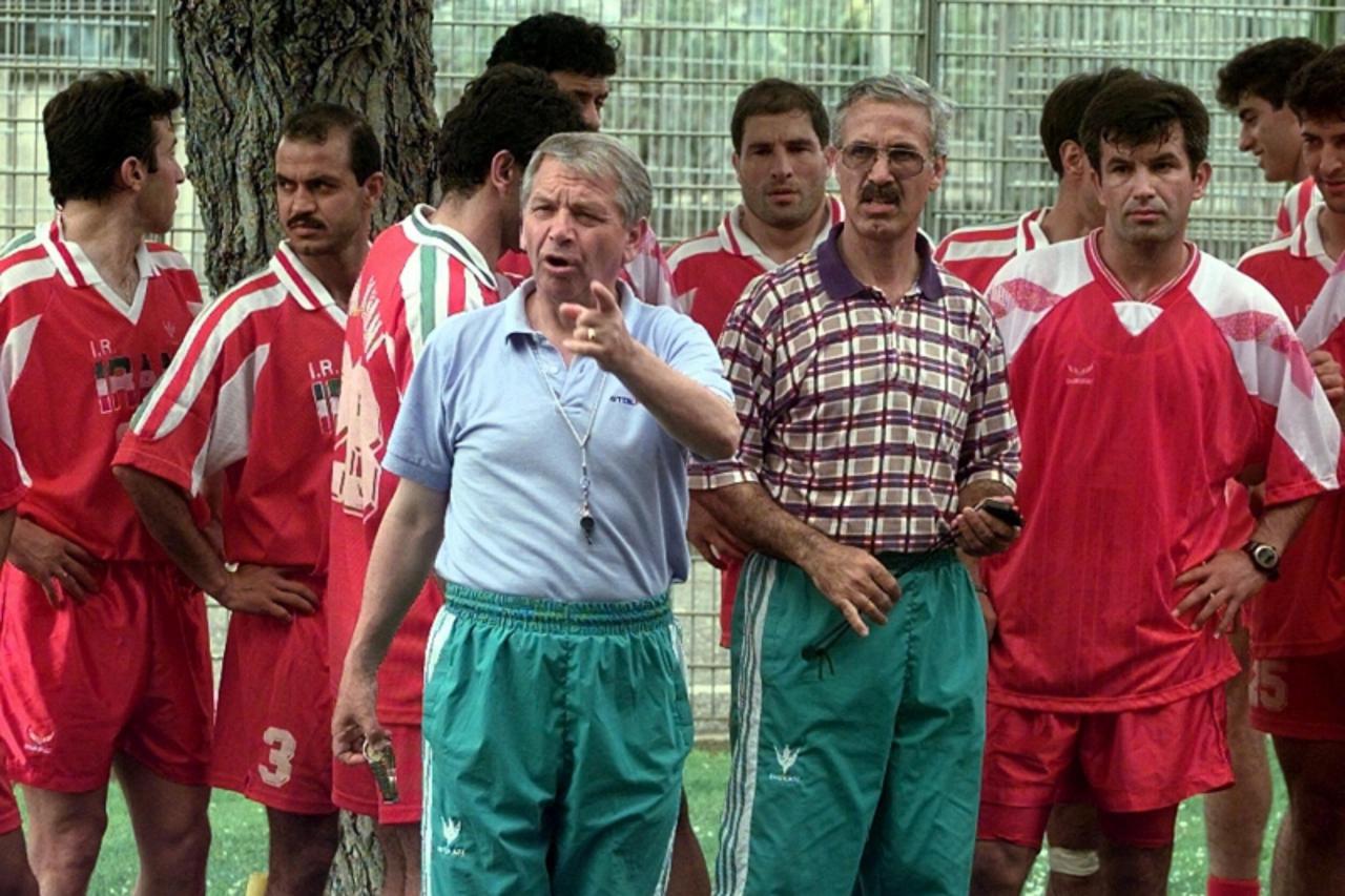 'Croatian coach of the Iranian national soccer team Tomislav Ivic during a training session with the team 15 May in Rome. Among them are Piyravani (5) and Zadeh (12). Iran will play in the F group wit