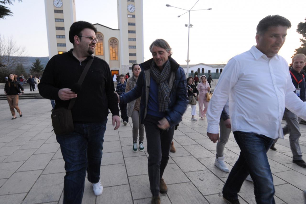 'bih...medjugorje ...26.03.2012...trener Manchester Cityja Roberto Mancini sa suprugom i kcerkom u dvodnevnom posjetu medjugorju... foto: zoran grizelj vecernji list'