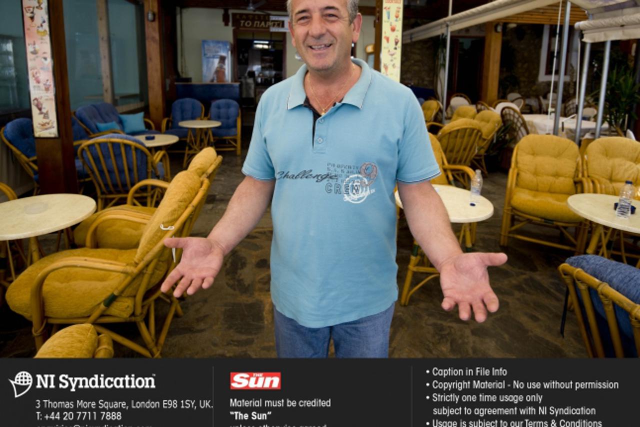 \'General scenes of the economic hard times in Greece, scenes from Athens and Crete. Cafe owner Stratos Stamatakis in Crete who wants tourists to keep coming to the island. Credit: The Sun Online righ