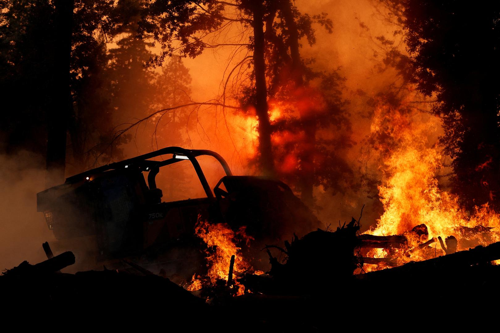 FILE PHOTO: A bulldozer is used to put out flames along Highway 32 near Forest Ranch, California, U.S. July 26, 2024. REUTERS/Fred Greaves/File Photo Photo: FRED GREAVES/REUTERS