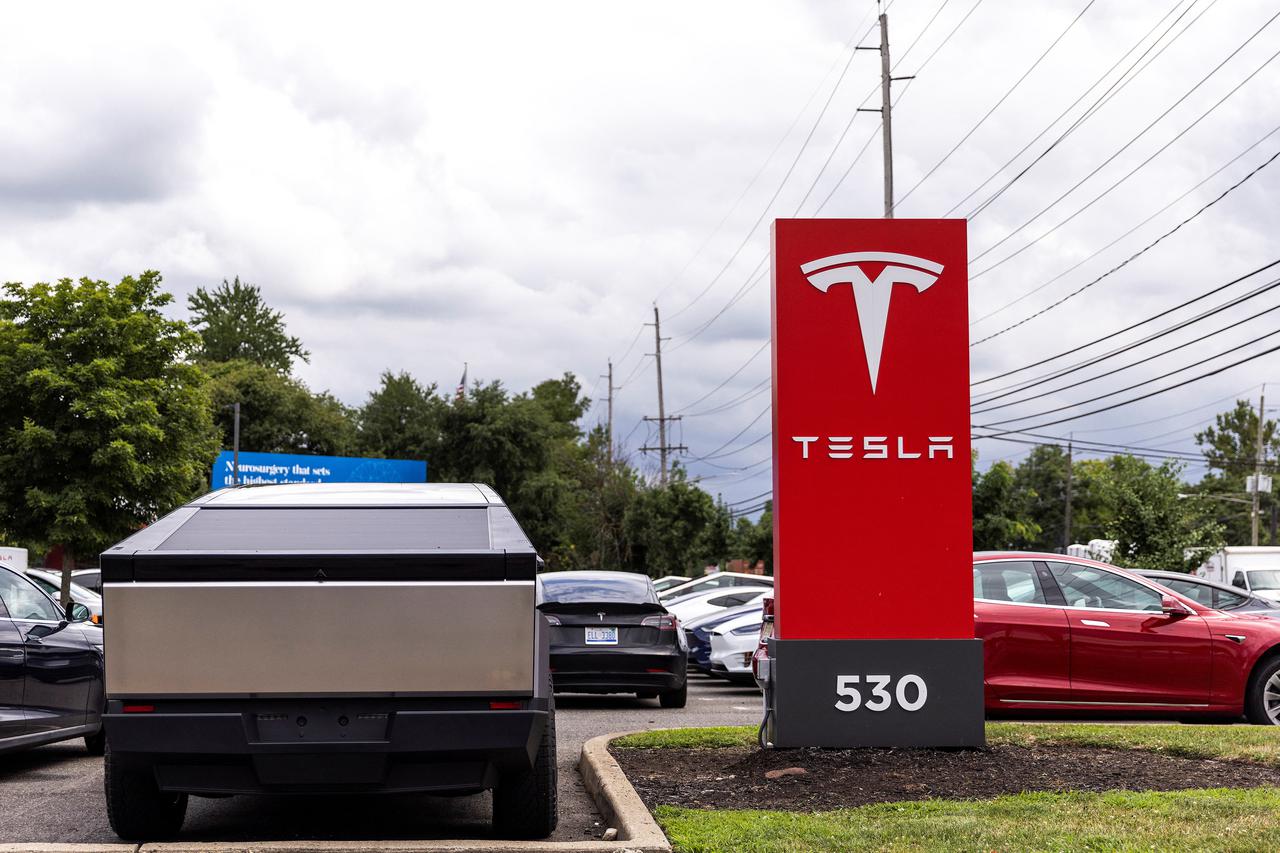 Tesla electric vehicles use a Tesla supercharging station in Union City, New Jersey