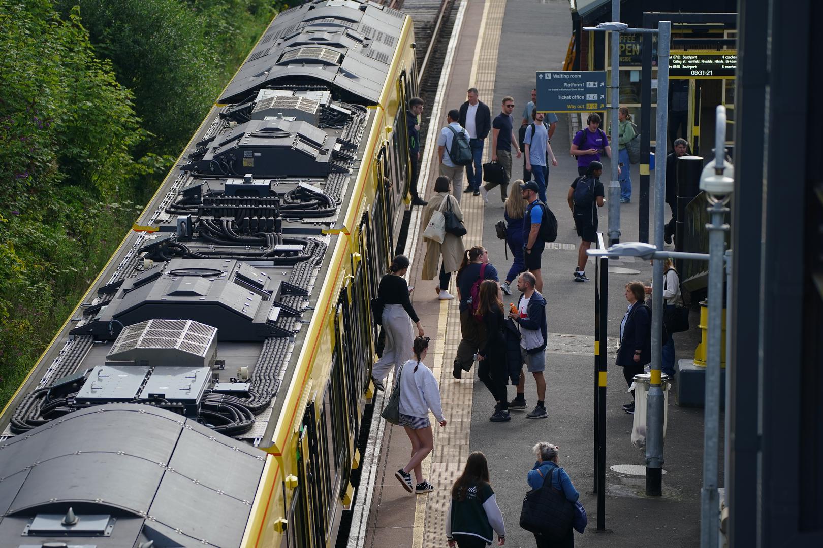 A general view of commuter disembarking a Great Northern railway train at Hunt's Cross station, Liverpool, amid reports of widespread IT outages affecting airlines, broadcasters and banks. Picture date: Friday July 19, 2024. Photo: Peter Byrne/PRESS ASSOCIATION