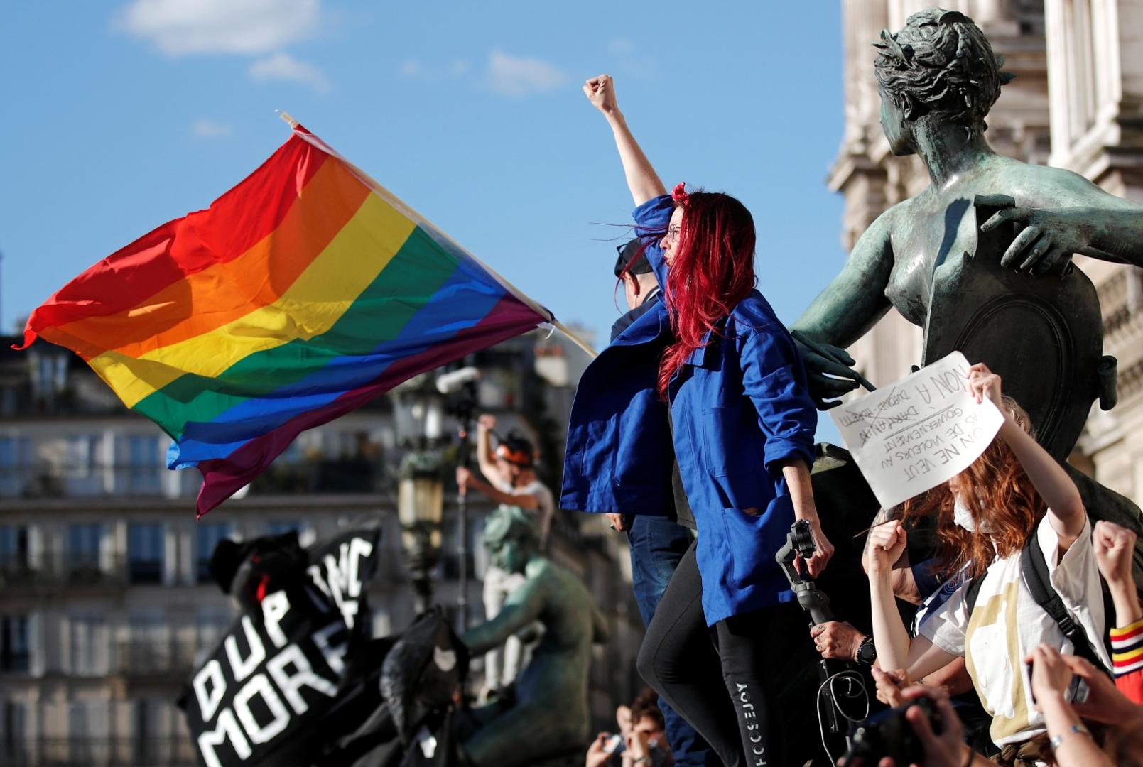 Feminist activists demonstrate against new government appointments in Paris A feminist activist gestures during a demonstration against the appointments of French Interior Minister Gerald Darmanin and Justice Minister Eric Dupond-Moretti in the new French government, in front of the city hall in Paris, France, July 10, 2020. REUTERS/Benoit Tessier BENOIT TESSIER