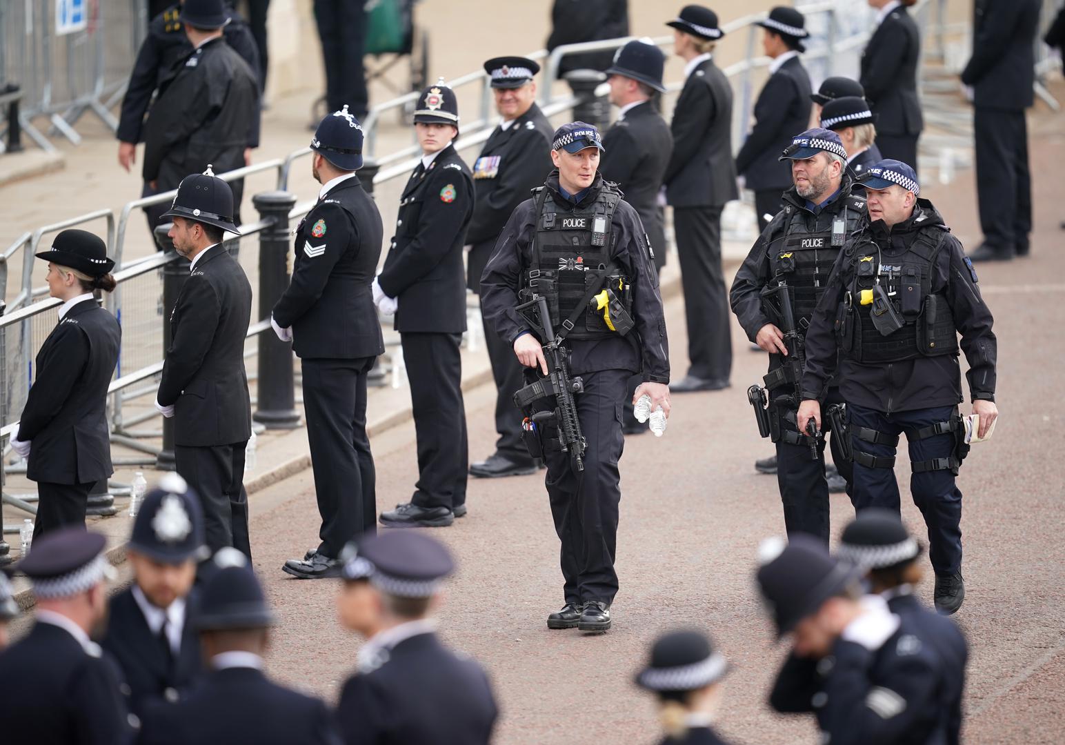 Armed police officers patrol the Mall ahead of the coronation ceremony of King Charles III and Queen Camilla in central London. Picture date: Saturday May 6, 2023. Photo: Niall Carson/PRESS ASSOCIATION