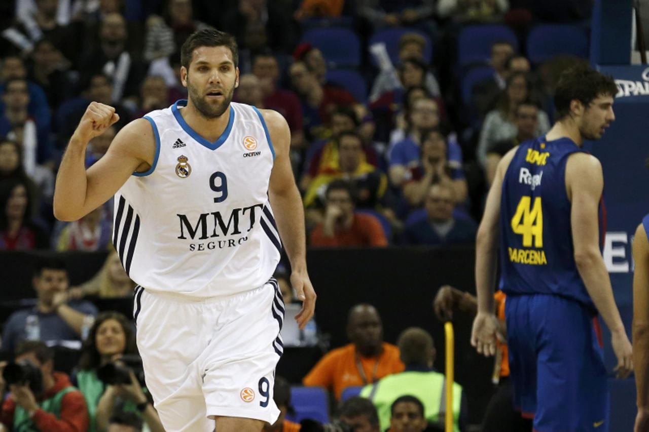 'Real Madrid\'s Felipe Reyes reacts after scoring during their Euroleague Final Four semi-final basketball game against Barcelona at the O2 Arena in London May 10, 2013.  REUTERS/Suzanne Plunkett (BRI