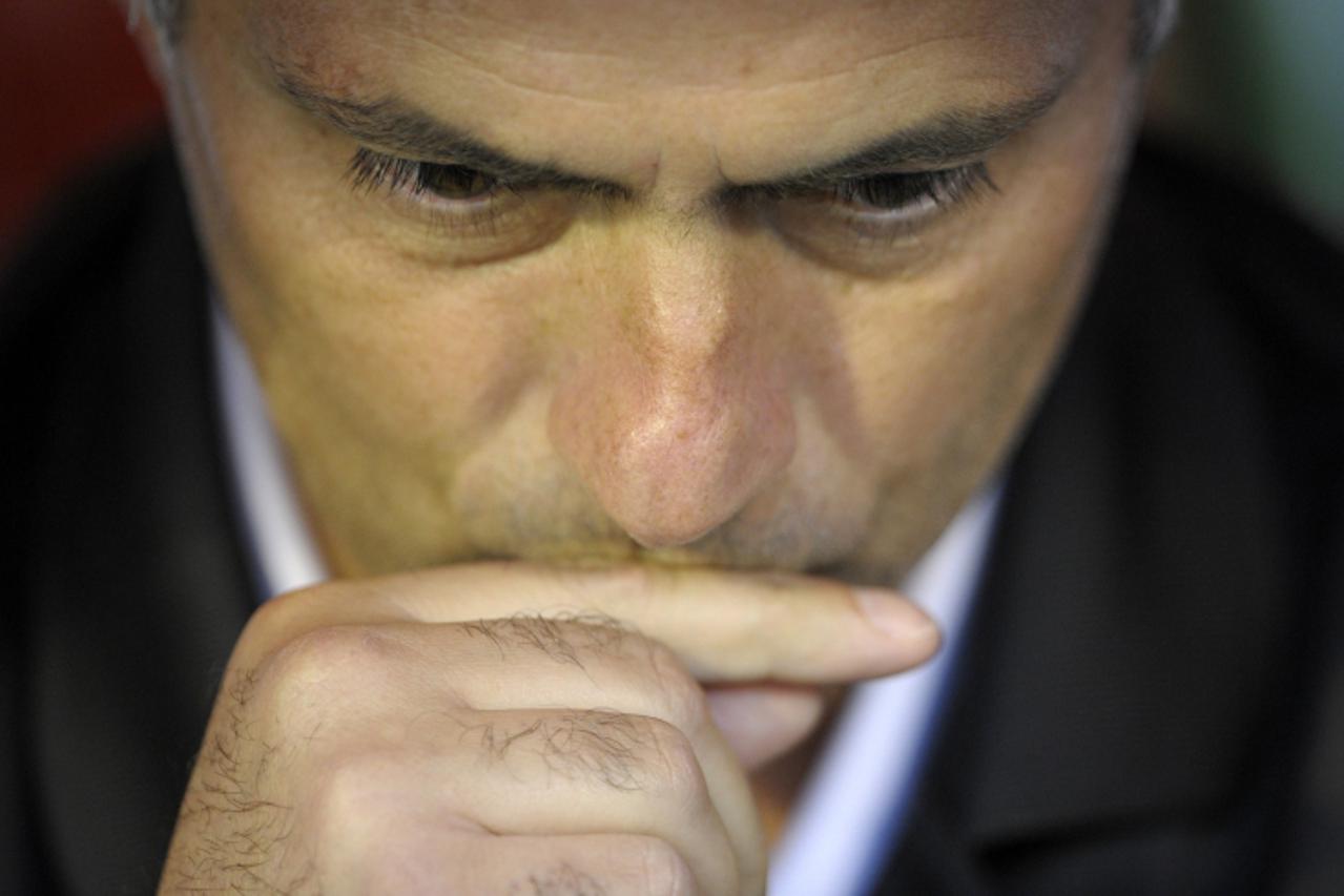 'Real Madrid\'s Portuguese coach Jose Mourinho is pictured in the bench before the start of the Spanish league football match Racing vs Real Madrid on september 21, 2011, at El Sardinero Stadium in Sa