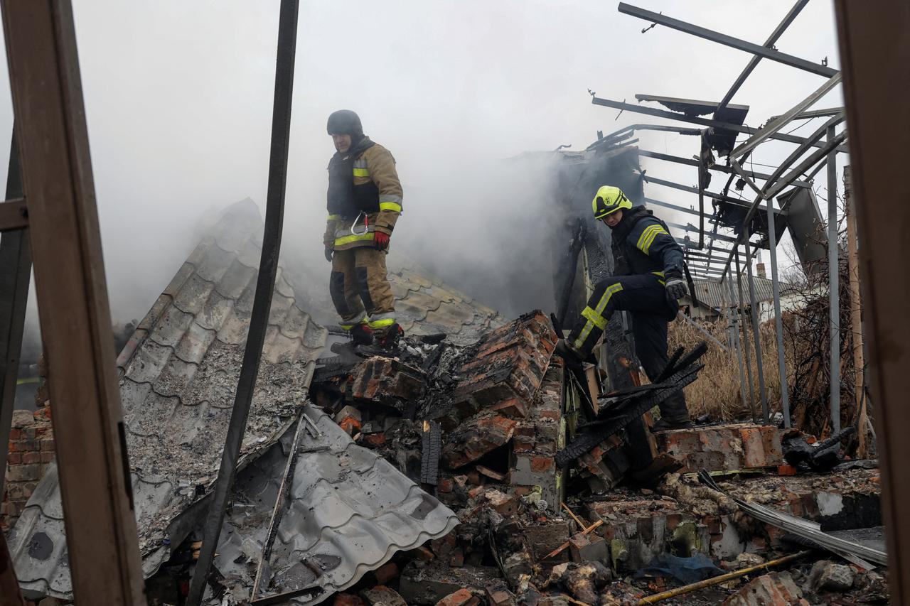 Firefighters work at the site of residential buildings hit by a Russian drone strike, amid Russia's attack on Ukraine