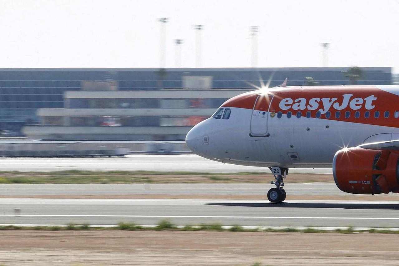 FILE PHOTO: EasyJet airliner lands at Son Sant Joan airport in Palma de Mallorca