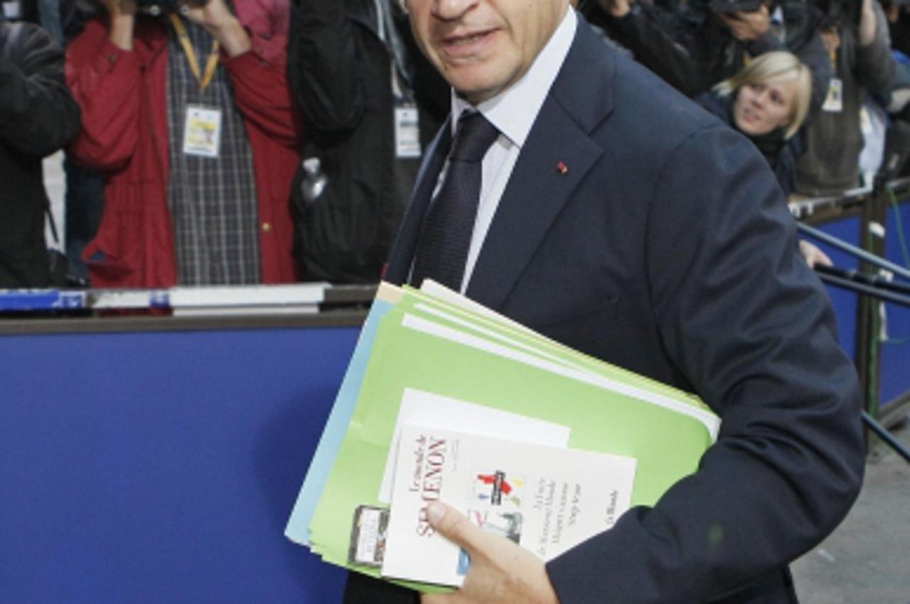 'France\'s President Nicolas Sarkozy arrives at an European Union leaders summit in Brussels June 24, 2011. European Union leaders, who are holding a summit in the Belgian capital,  promised more mone