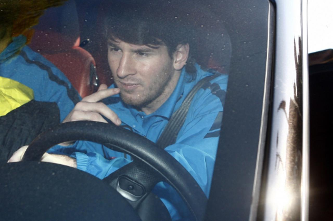 'Barcelona\'s player Lionel Messi drives his car after a training session at Nou Camp stadium in Barcelona, December 4, 2010. Barcelona\'s La Liga match away to Osasuna has been postponed until Sunday