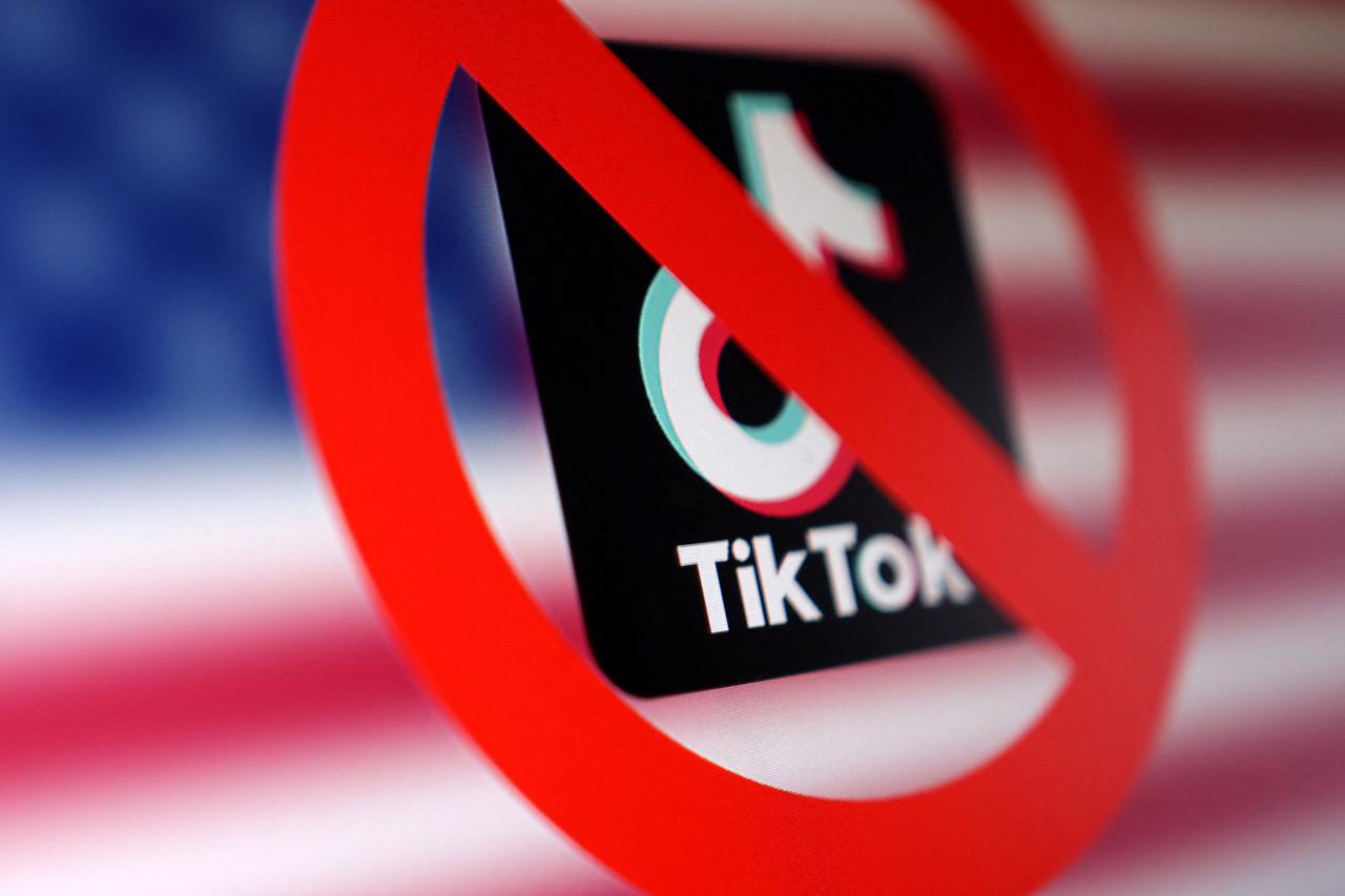 Illustration shows U.S. flag, TikTok app logo and forbidden sign