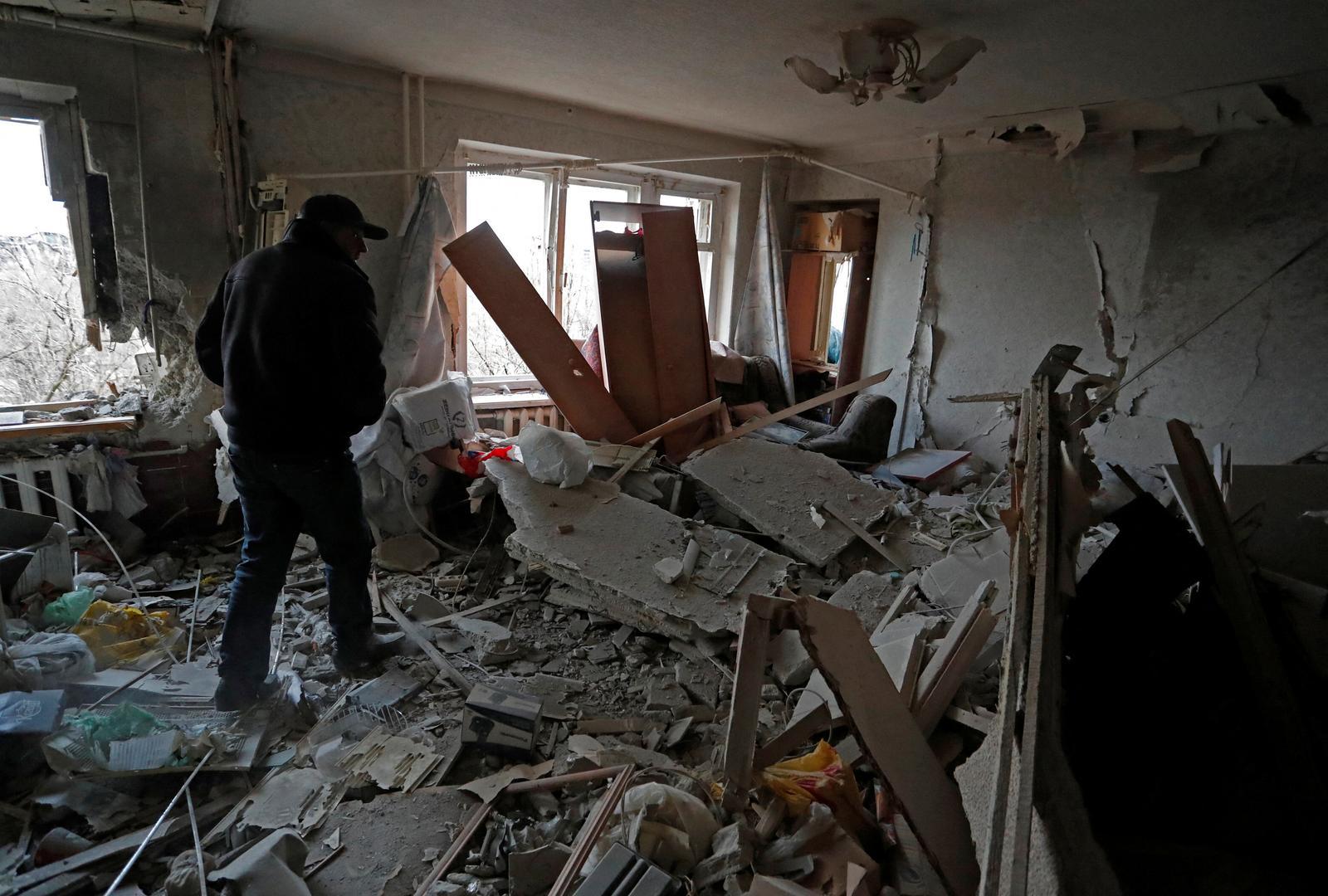 A local resident walks inside an apartment which was damaged during Ukraine-Russia conflict in the besieged southern port city of Mariupol, Ukraine March 18, 2022. REUTERS/Alexander Ermochenko Photo: Alexander Ermochenko/REUTERS