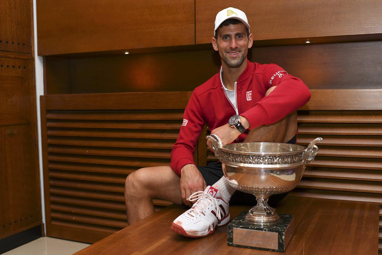 Tennis - French Open Mens Singles Final match - Roland Garros - Novak Djokovic of Serbia vs Andy Murray of Britain - Paris, France - 05/06/16.  Novak Djokovic poses with trophy. REUTERS/Nicolas Gouhier/FFT/Pool  Picture Supplied by Action Images