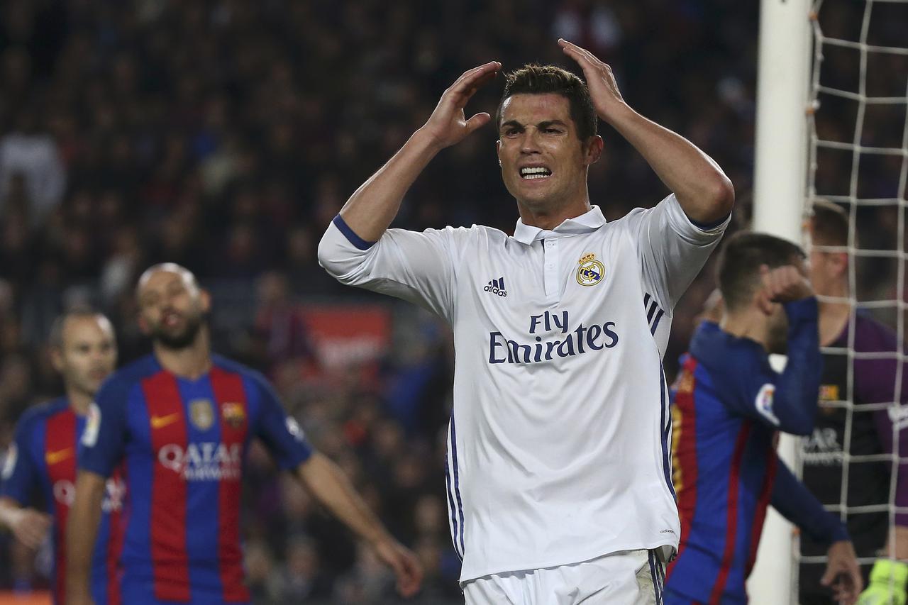 Football Soccer - Barcelona v Real Madrid - Spanish La Liga Santander- Nou Camp Stadium, Barcelona, Spain - 3/12/16. Real Madrid's Cristiano Ronaldo reacts after missing a chance to score during the 