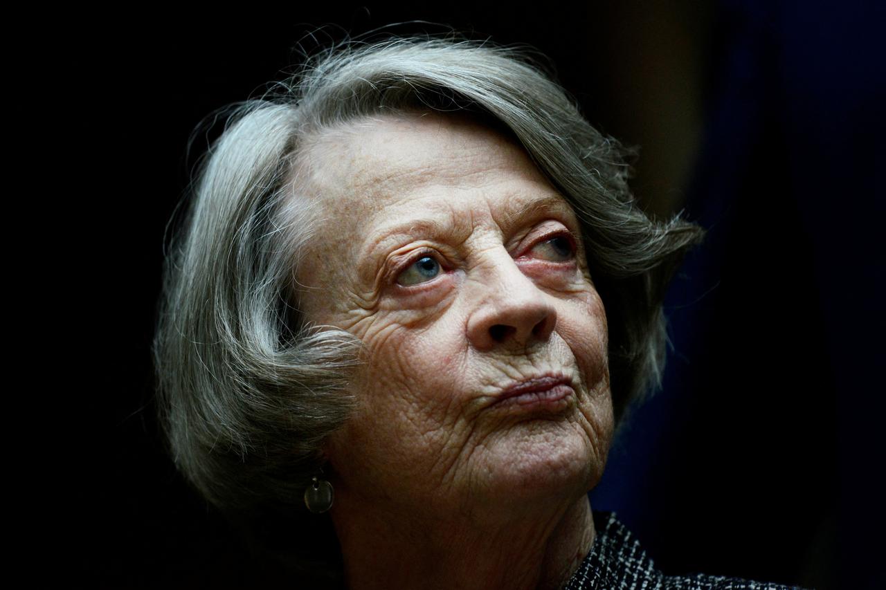 FILE PHOTO: Downton Abbey cast member Maggie Smith poses for the media at a hotel in London