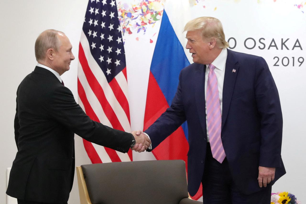 FILE PHOTO: Russia's President Vladimir Putin and U.S. President Donald Trump attend a meeting on the sidelines of the G20 summit in Osaka