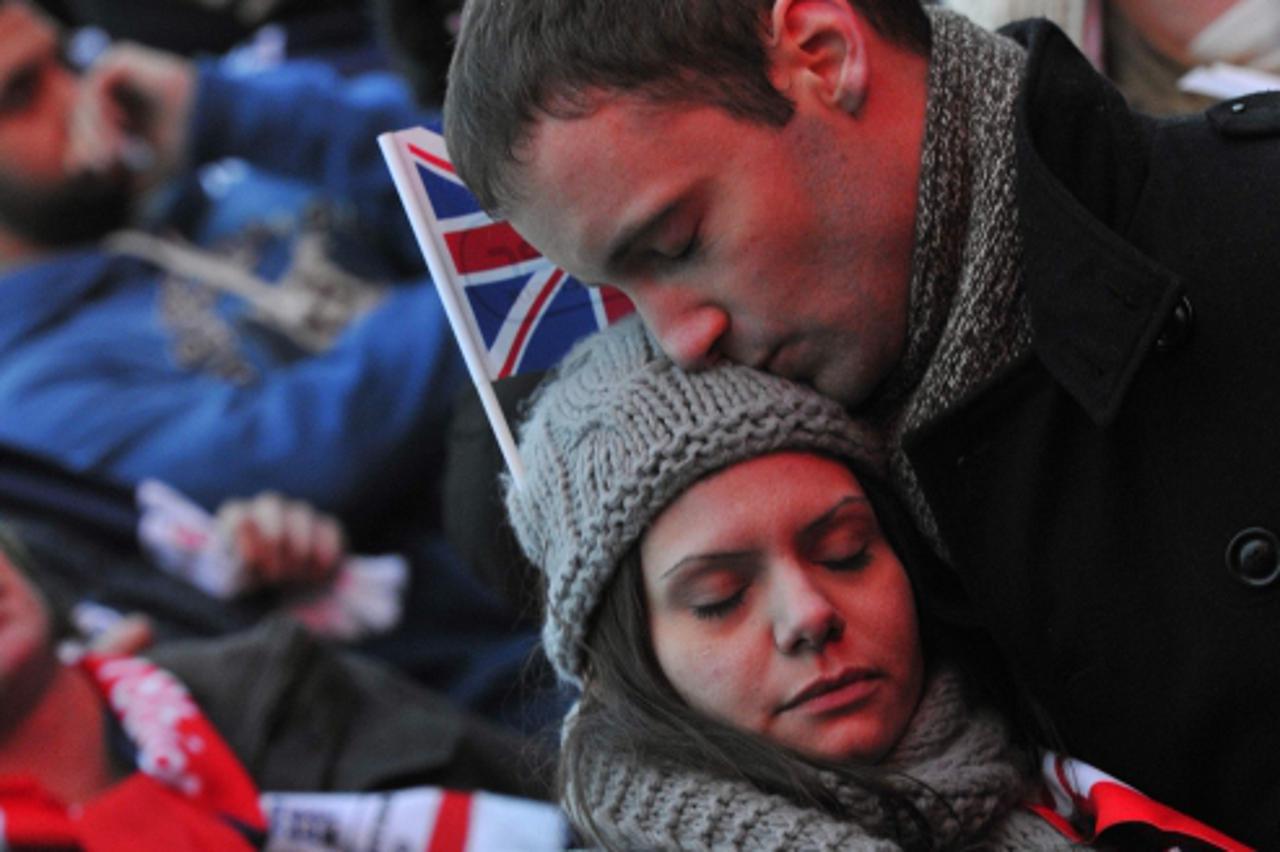 \'Fans react as they watch a televised outdoor screening of the World Cup 2018/2022 soccer host decision in central London December 2, 2010. Russia and Qatar will host the World Cup finals in 2018 and