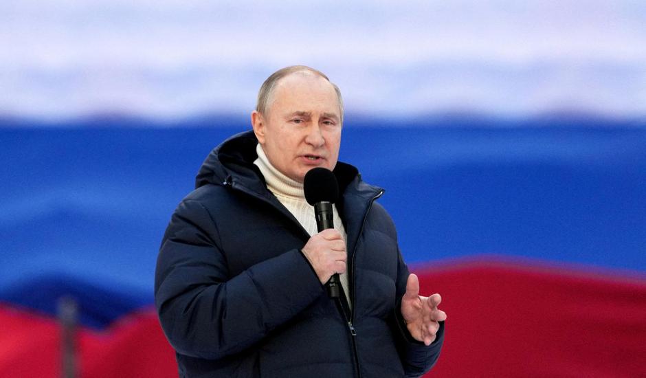 FILE PHOTO: Russian President Vladimir Putin attends a concert marking the eighth anniversary of Russia's annexation of Crimea in Moscow