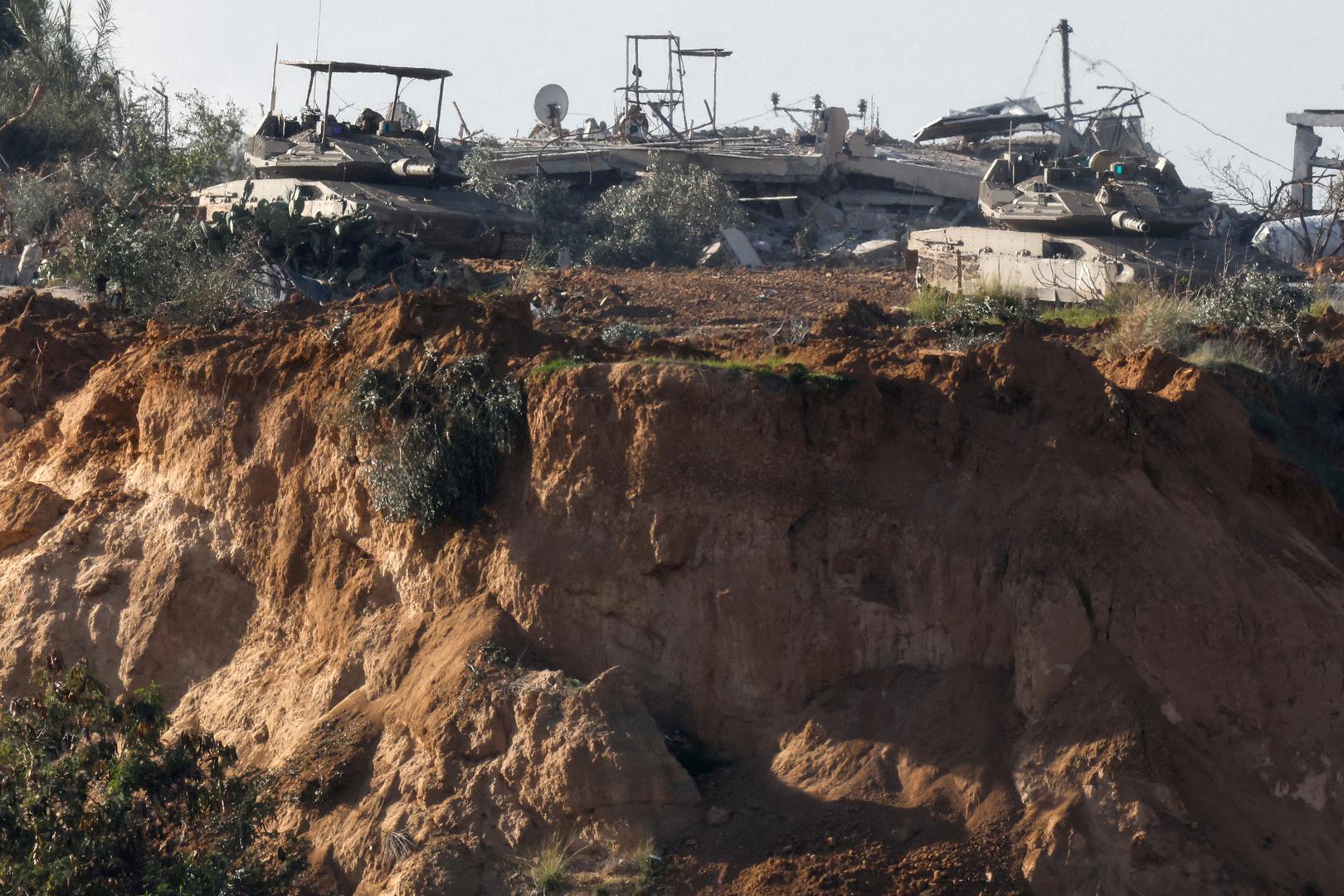 Tanks manoeuvre in central Gaza, amid the ongoing conflict between Israel and the Palestinian Islamist group Hamas, near the Israel-Gaza border, as seen from Israel, January 13, 2024. REUTERS/Amir Cohen Photo: AMIR COHEN/REUTERS