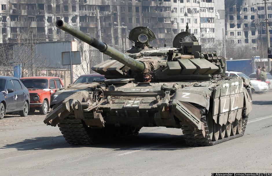 A tank of pro-Russian troops drives in a street in Mariupol