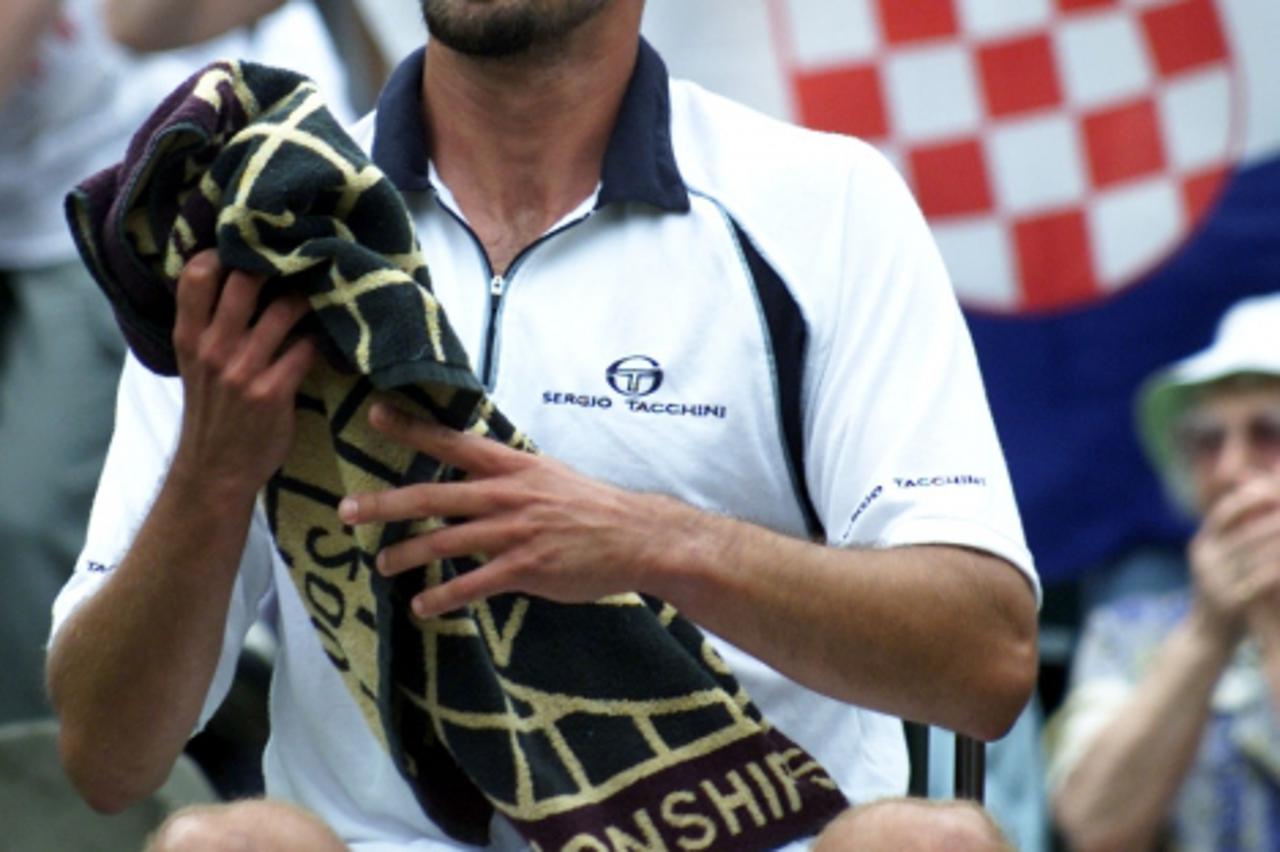 'Ivanisevic v Rafter NO COMMERCIAL USE: Goran Ivanisevic of Croatia in front of the Croatian flag during his match against Australia\'s Pat Rafter during the Mens Final of the 2001 Lawn Tennis Champio