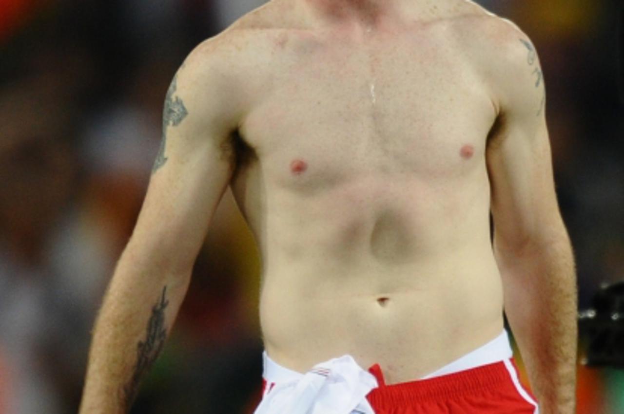 'England\'s striker Wayne Rooney reacts after the 2010 World Cup round of 16 football match England versus Germany on June 27, 2010 at Free State Stadium in Mangaung/Bloemfontein. Germany won the matc