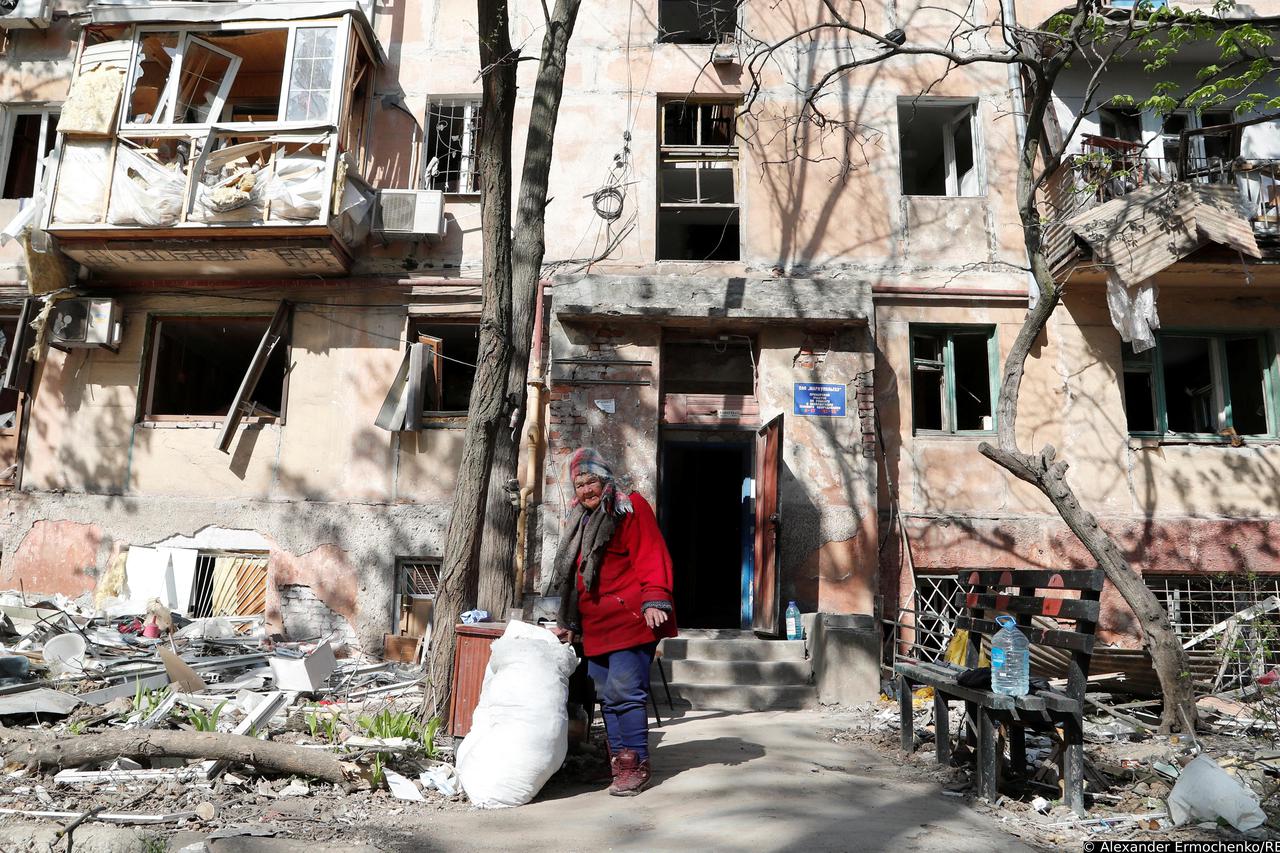 A view shows a damaged residential building in Mariupol