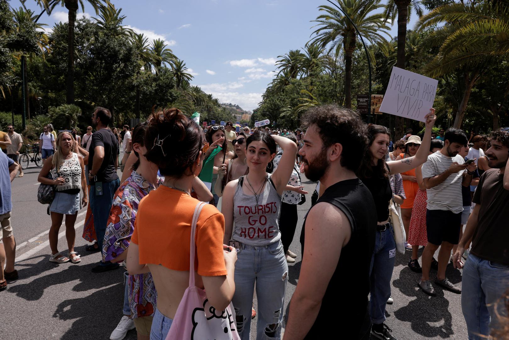People take part in a demonstration against mass tourism, under the motto "Malaga to live, not to survive" in reaction to real estate high prices, driven by the increase of tourist accomodations, in Malaga, Spain, June 29, 2024. REUTERS/Jon Nazca Photo: JON NAZCA/REUTERS
