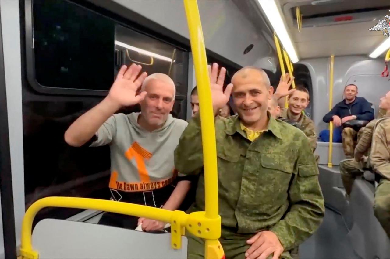 A still image from a video shows what it said to be captured Russian service personnel in a bus following the latest exchange of prisoners of war at an unknown location in the course of Russia-Ukraine conflict