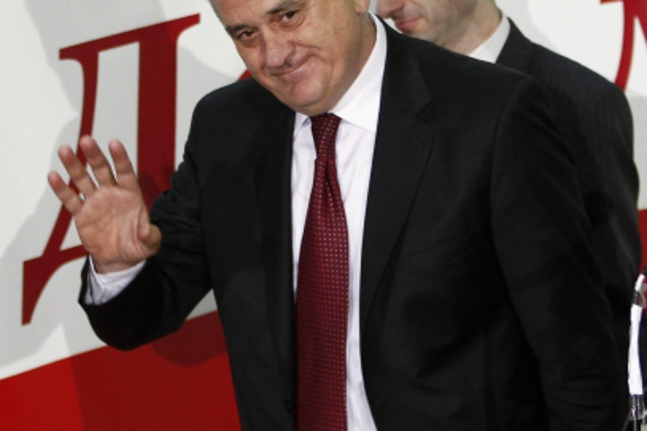 'Serbian Progressive Party candidate for the 2012 presidential election Tomislav Nikolic (front) reacts in his party\'s headquarters in Belgrade May 6, 2012. Serbia\'s incumbent liberals and right-win