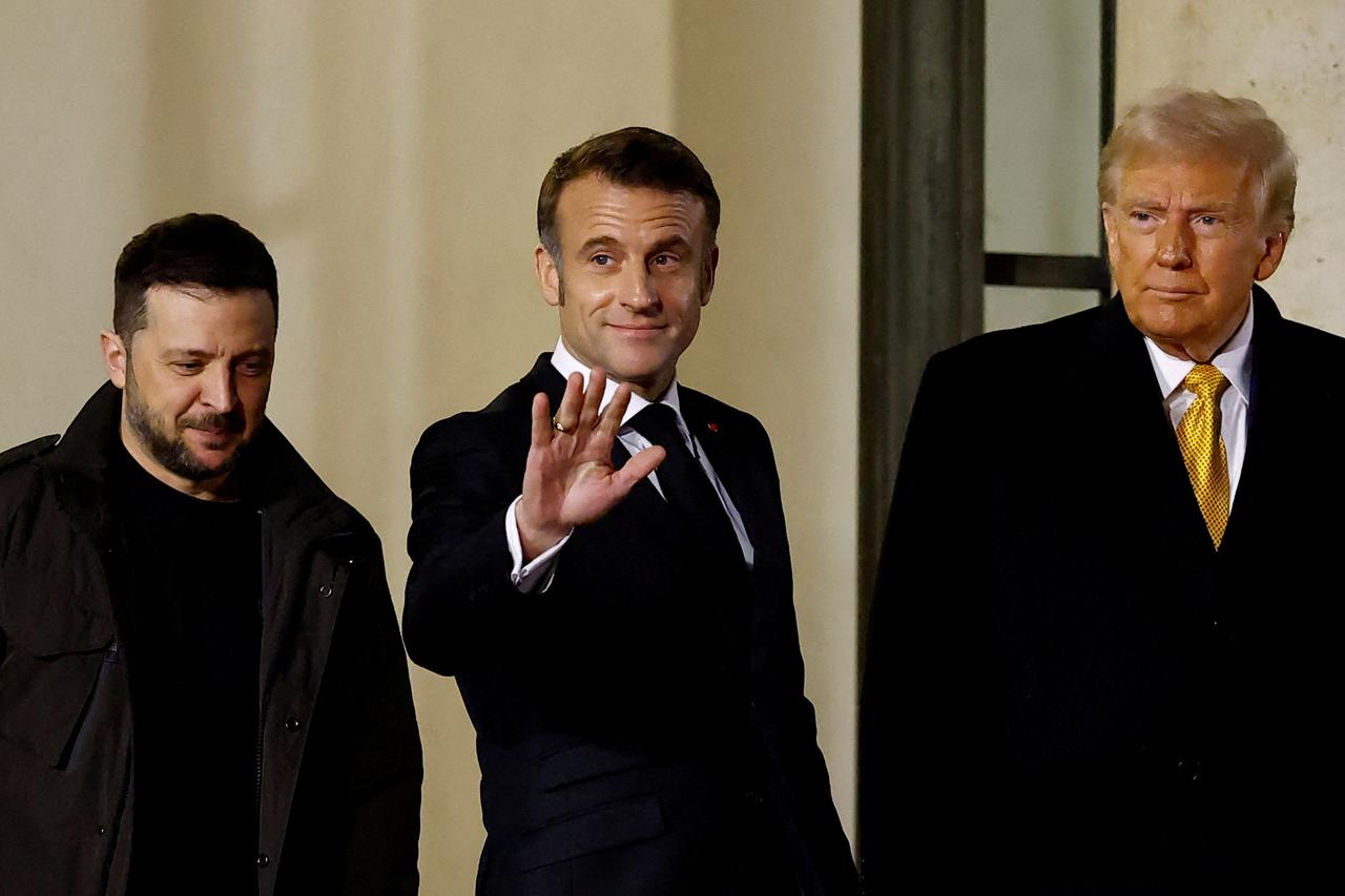 FILE PHOTO: Zelenskiy, Macron and Trump are pictured in Paris