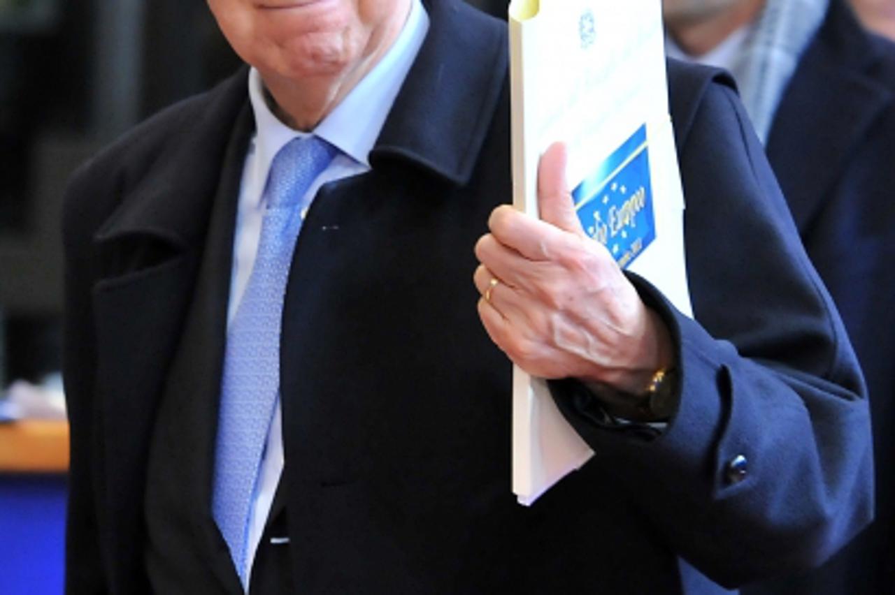 'Italy Prime Minister Mario Monti leaves after talks gathering European Union (EU) heads of State or government during an European Union summit at the EU headquarters, early on December 9, 2011 in Bru